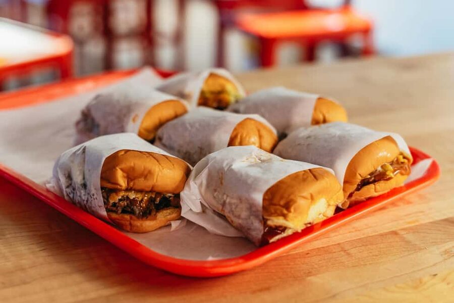 East Nashville Walking Food Tour with 5+ Tastings - Main meal tastings: Nashville hot chicken, hand-crafted Crustburger, and what to order