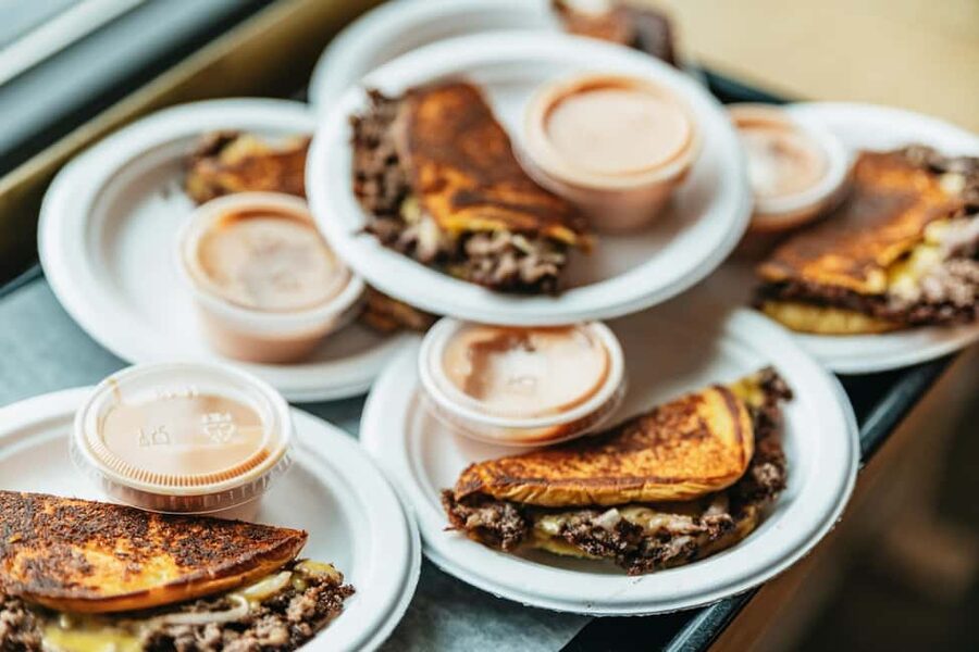 East Nashville Walking Food Tour with 5+ Tastings - Nashville Farmers Market Food Hall: the Memphis-style pulled pork sandwich you should taste slowly